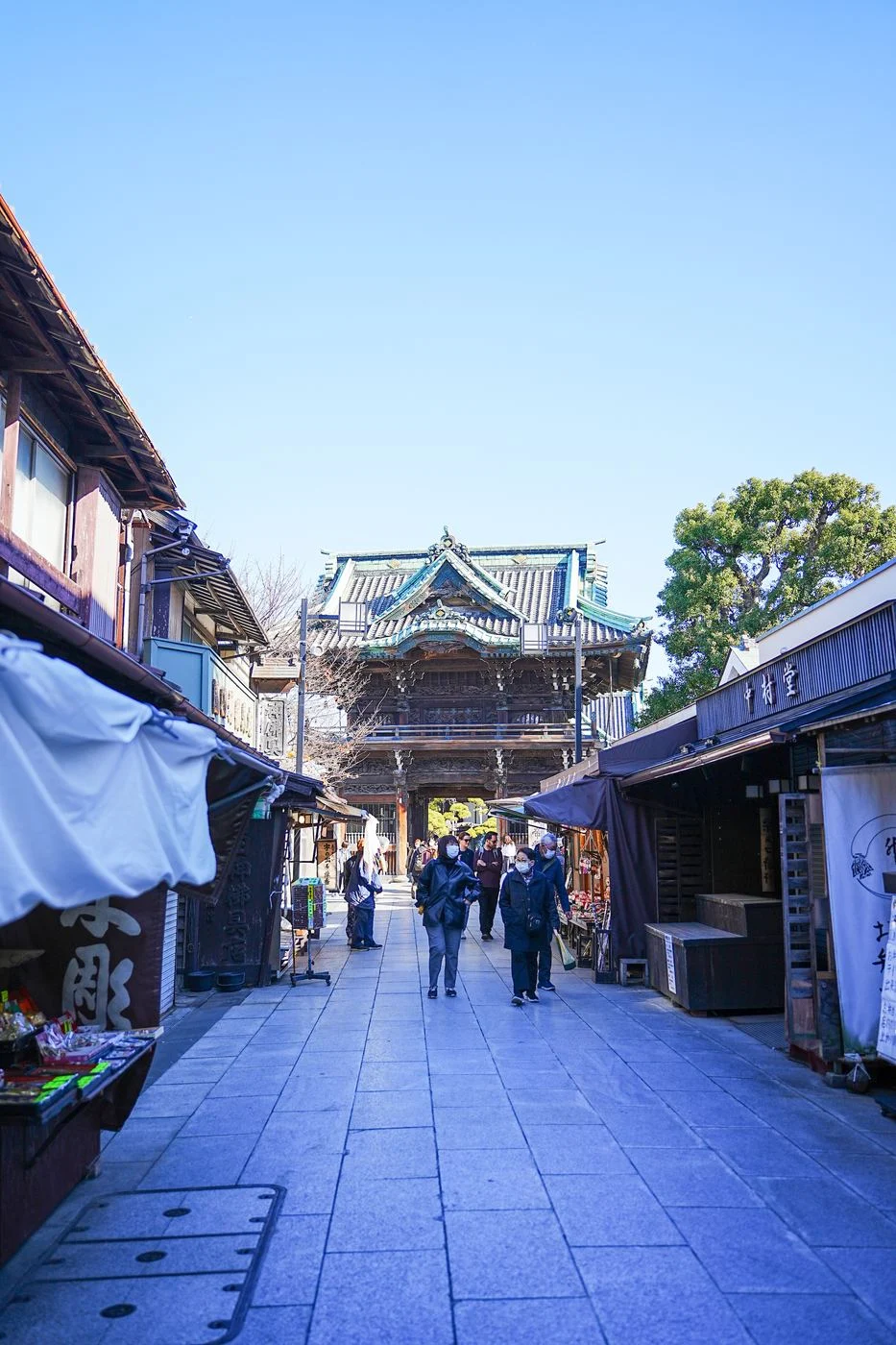 The Taishakuten shopping street, with the temple gate at the end