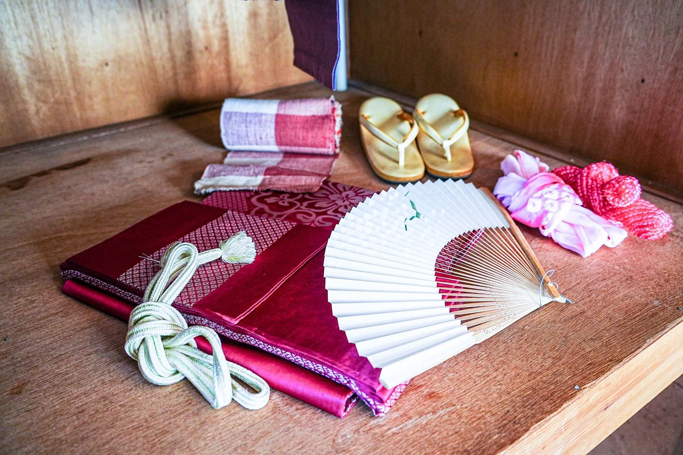 A folding fan and kimono accessories